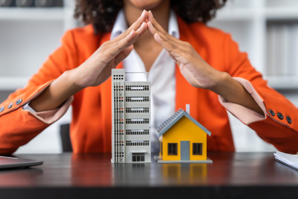 African American realtor working at desk, Housing estate, Vacanc
